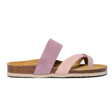 A pair of salmon pink suede sandals with a cork sole, handmade in Spain.